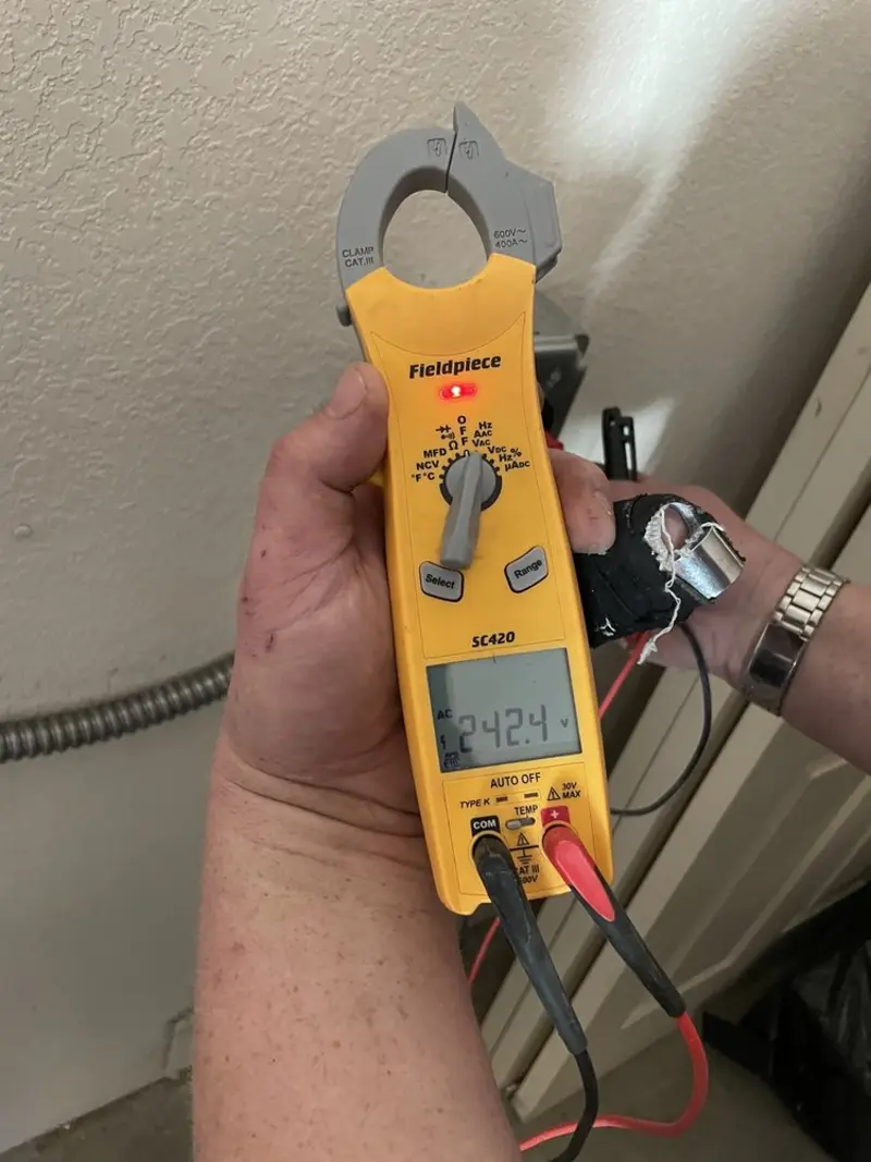 Voltage testing with clamp meter during Electrical Installation Services in Boca Raton